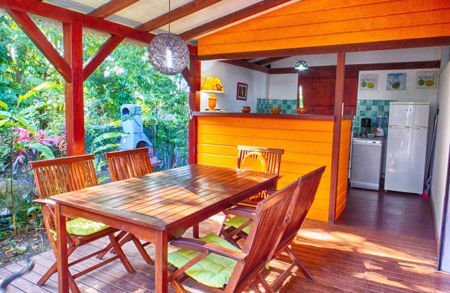 Comfortable bungalow in a garden with dense tropical vegetation