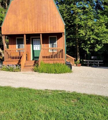 Comfortable Camping Cabins with View of the Cedar River for a Family Weekend Getaway