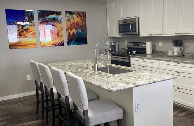 Contemporary 1400 sq ft space in lower level Open concept gas burning fireplace