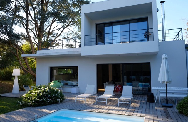 Contemporary house opening onto a large, quiet terrace close to the beach