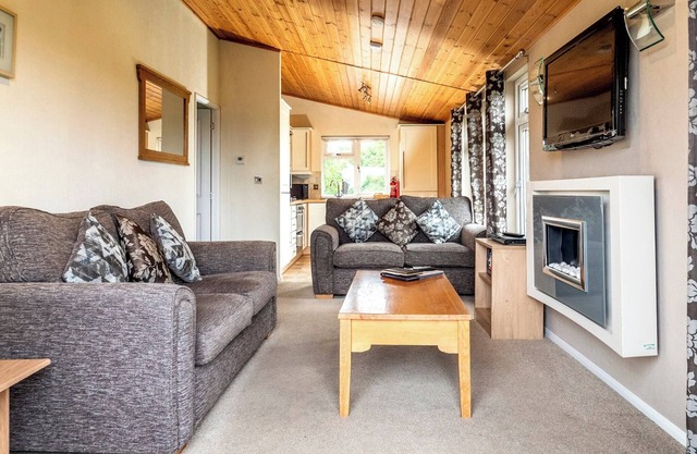 Contemporary luxury lodge with luxurious king-size bed.