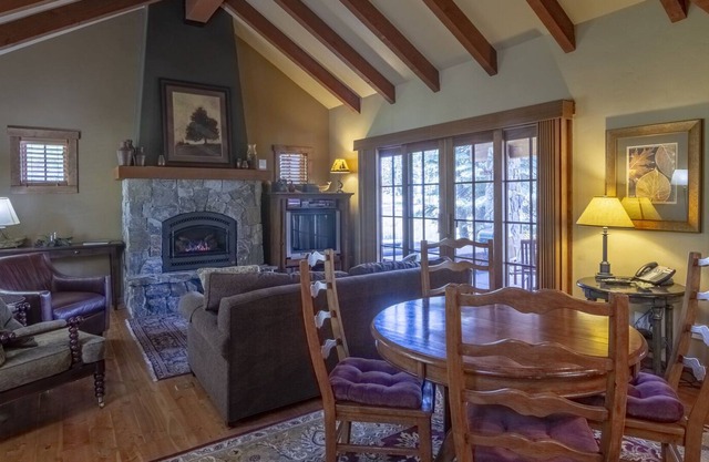 Cozy Living Room w/ Stone Fireplace | POMA Lift Access | Private Hot Tub & Patio