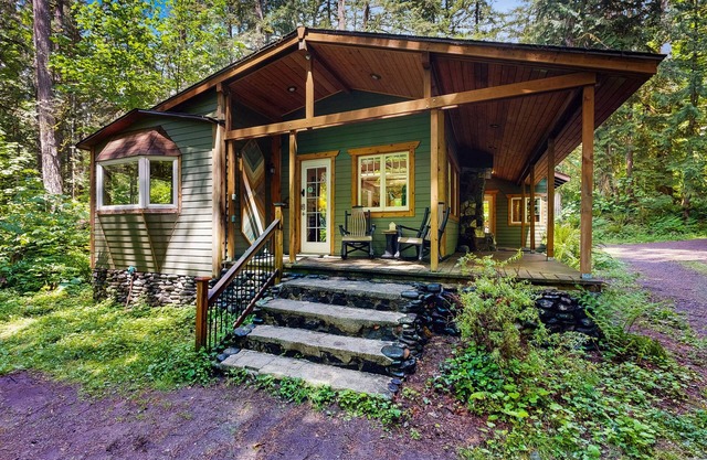 Cozy Riverfront Cottage with Charming Interior & Hot Tub - Dog-Friendly