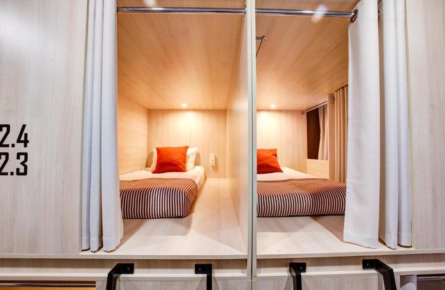 Dad and Cat Capsule Hotel