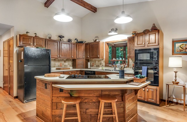 Dog & family-friendly house w/forested lake views, waterfront, and private dock