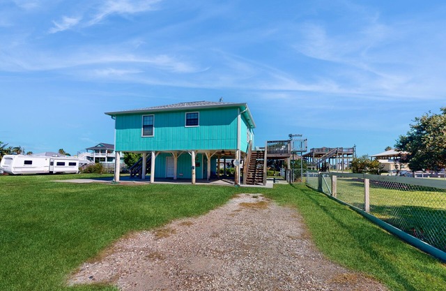 Dog-friendly, canal-front home with boat ramp, dock, large yard, WiFi, & AC