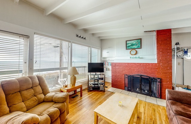 Dog-friendly home with deck & ocean views - close to the beach