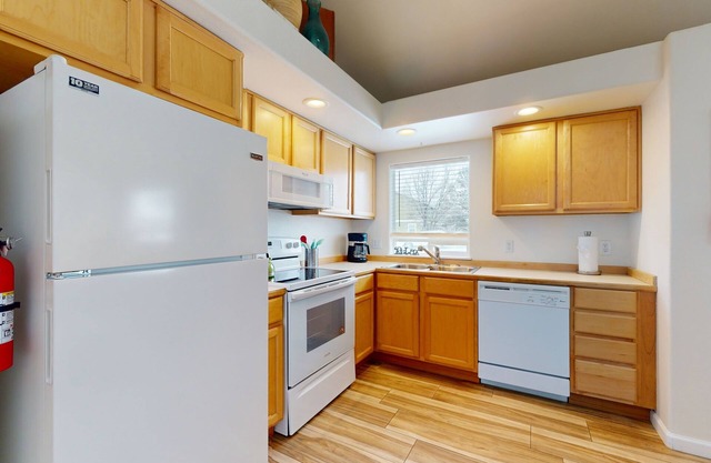 Dog-friendly perfectly located duplex with patio, grill, smart TVs, & games