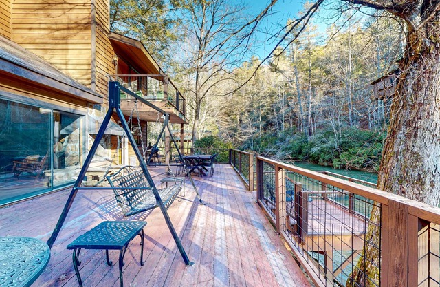 Dog-friendly, riverfront retreat with game room, washer/dryer, wraparound deck