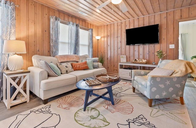 Dog-friendly 3BR beach retreat with 2 kitchens, covered hangout areas, steps from the shore!