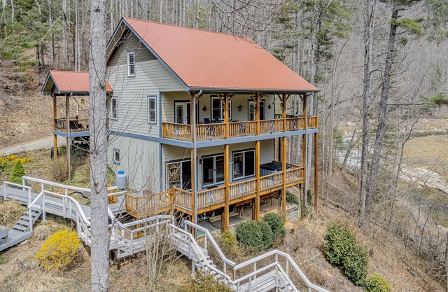Dog-friendly, waterfront home with hot tub, two kitchens, AC, fireplace, & W/D
