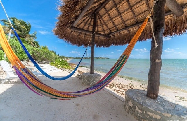 Eco-chic beachfront villa, embrace the ocean breezes and white sandy beach!