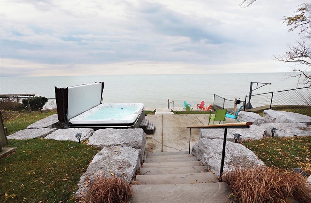 Embrace Lake Erie in our charming 2-story nautical waterfront cottage. n