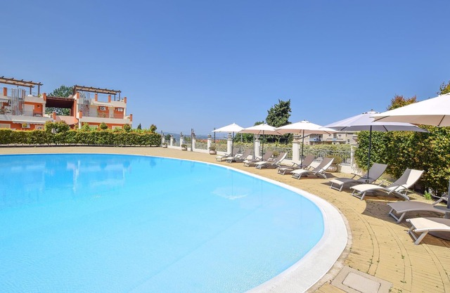 Enjoy a wonderful sea view in this vacation apartment with community pool.