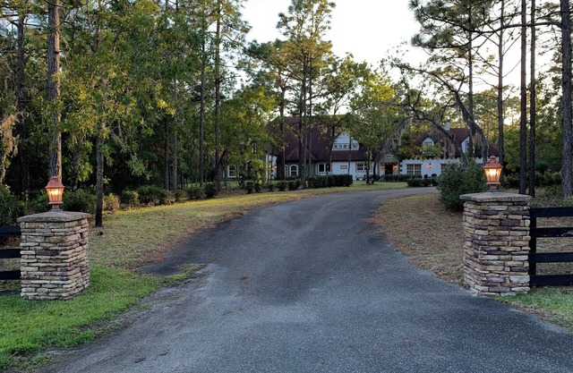 Escape to this serene 4-bedroom home set on 10 private acres.