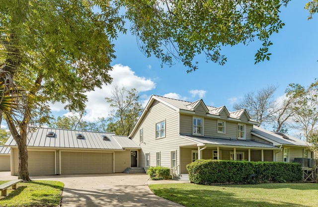 Expansive home on the water with dock, large deck, shared pool & central AC