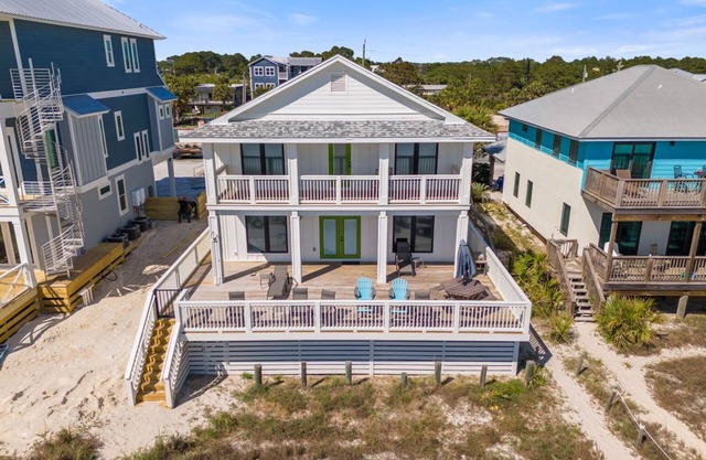 Experience luxury at the Diamond in the Rough! 5-bedroom beachfront home in Pier Park Area