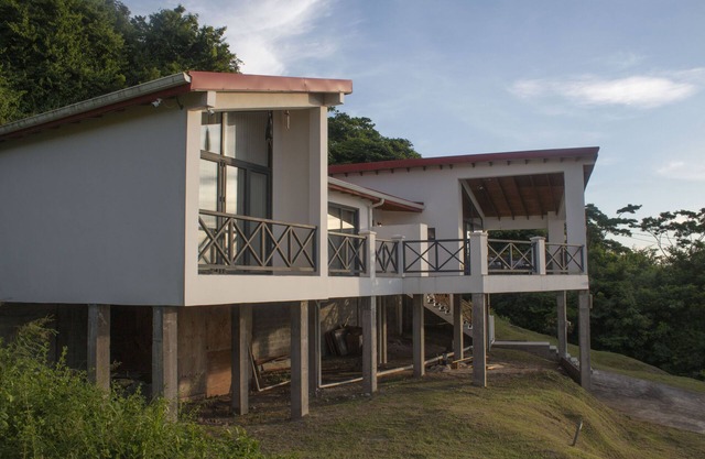 "Exquisite Hilltop Villa with Breathtaking Panoramic Views of the Caribbean Sea"