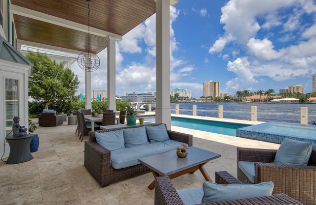 Exquisite waterfront home with a pool, large yard, & grill - close to the beach