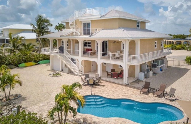 Extraordinary waterfront custom home, pool 56'dock ,ice machine,kayaks,bikes,ect