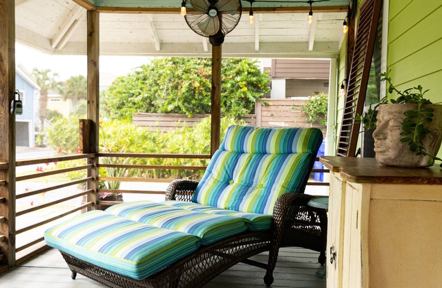 Family getaway with screened-in porch steps from surf and sun!