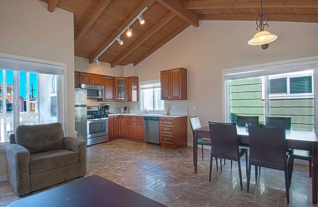 Fantastic and newly-remodeled upper unit just one house from the warm sand