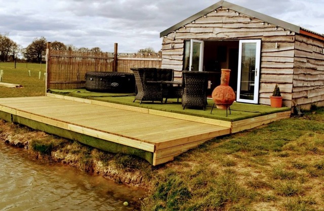 Fir Cone Cabin, set in the beautiful countryside next to a private fishing lake.