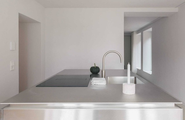 GARDEN FLOOR EAST: wood-burning stove and terrace to the southeast