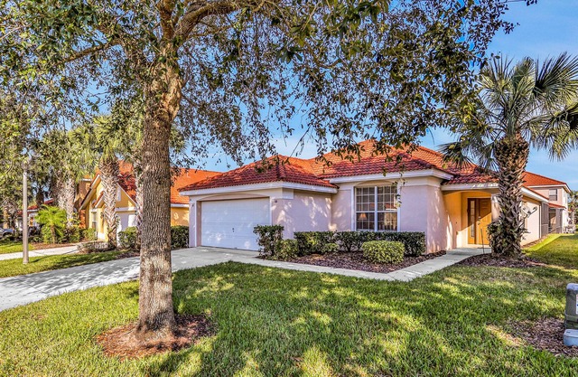 Gated community home with game room, furnished lanai, pool, & AC - dog-friendly