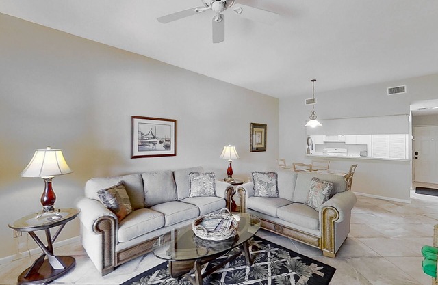 Gated resort community condo with water views, pool, hot tub, & balcony