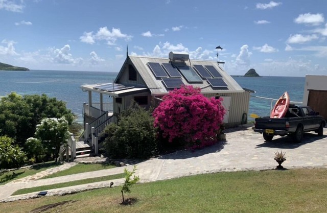Secluded romantic getaway with the turquoise Caribbean sea just steps away.