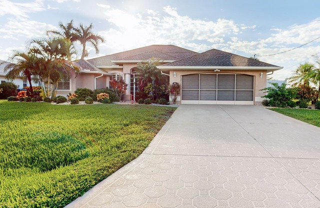 Golf course-view retreat with a private, heated pool, lanai, AC, & washer/dryer