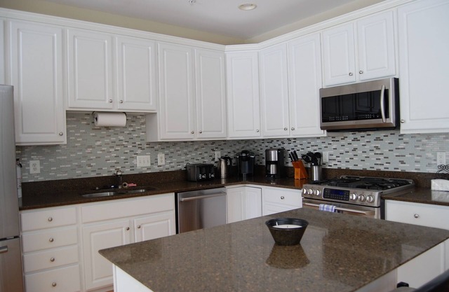 Golfers? Kids? Pets? This elegant town home is beautifully furnished and is located in the Bay Hills golf course community.