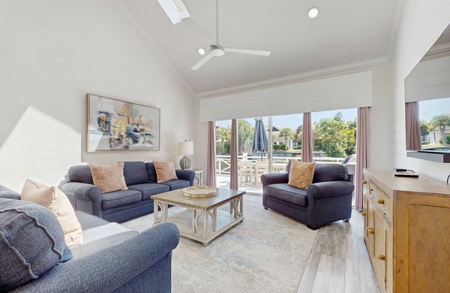 Gorgeous waterfront home with patio/deck, golf cart & shared pool/hot tub