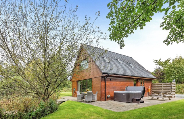 Ground floor: Spacious open plan lounge, kitchen, dining area with log burner.