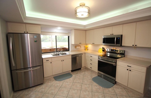 Heated screened in private salt water pool.