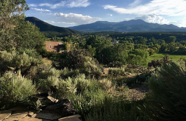 Historic Taos Adobe Overlooking Lush Valley