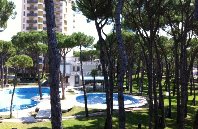 Holiday Apartment "Residence Pineta 126" with Shared Pool, Private Terrace & Wi-Fi