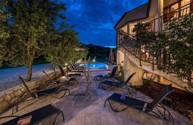 Holiday apartment with sea view and pool