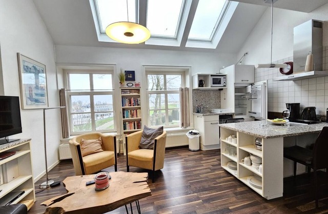 Holiday home Pewsum in Greetsiel - cozy holiday home for up to 2 people directly at the harbor with a view of the harbor - pets are welcome.