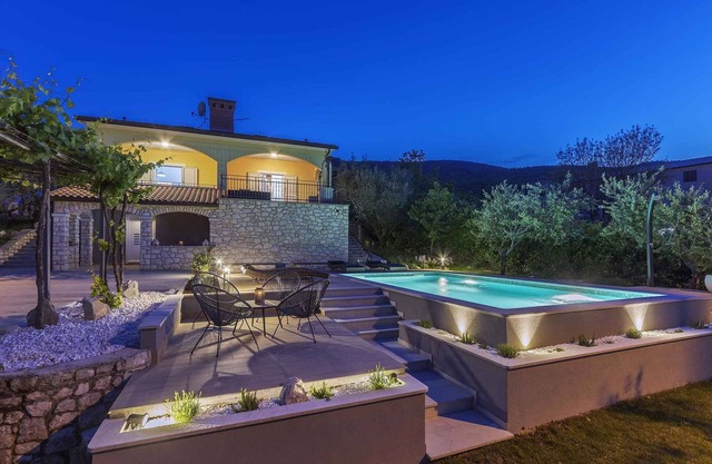 Holiday home with swimming pool, terrace and sea view