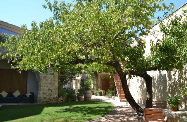 Holidays in Lagrasse. Stunning medieval apartment set in walled garden with pool