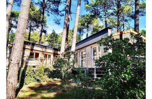 House in the pines between lake and ocean