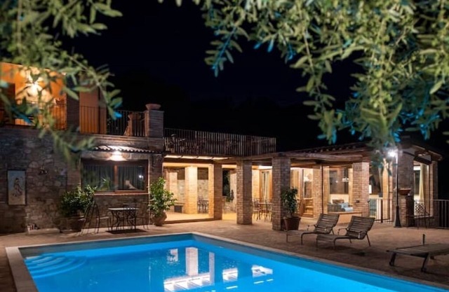In the charming Umbrian countryside near Orvieto, villa with pool and waterfall.