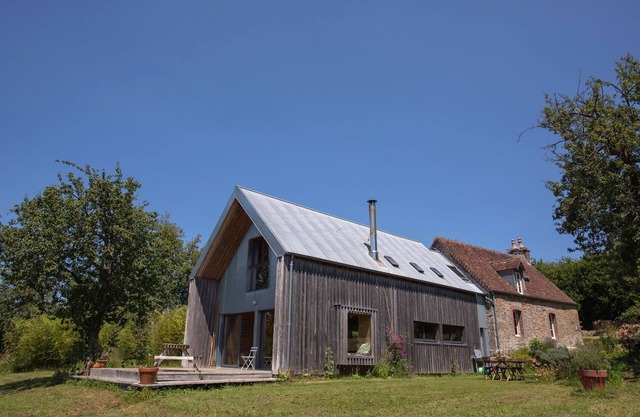 In the Normandy countryside, charming wooden architect's house.