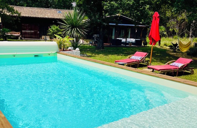 LA CABANE" room with heated pool and forest view.