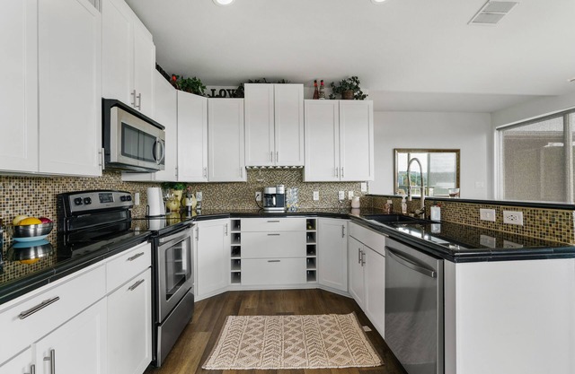 Lake view Home with Billiards, Arcade, Theater, Ping Pong, Hot tub and more.