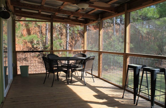 Lakefront home on 18 acres with covered deck & boat ramp access