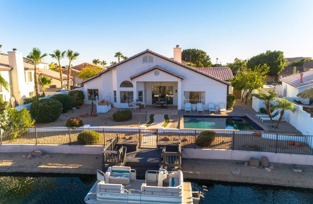 Lakefront Oasis | Heated Pool, Spa + Private Dock w/Boat