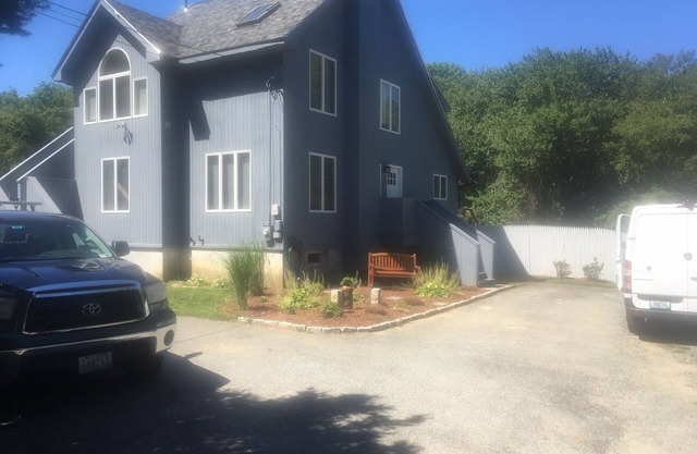 Large Modern Home Set On 2 Private Acres Located Near Beach